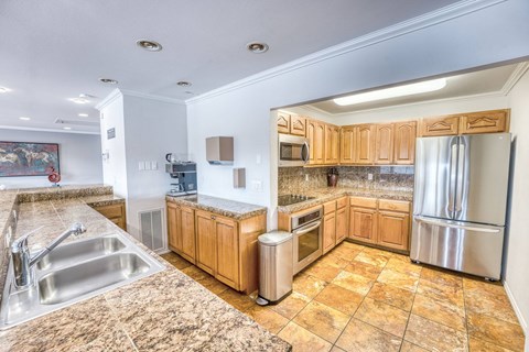 a large kitchen with a round ceiling and wood cabinets